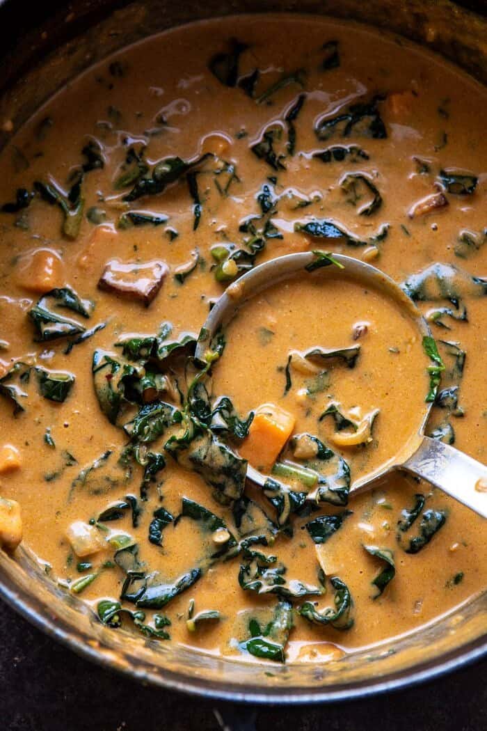 Spicy Peanut Soup in soup pot with ladle in pot