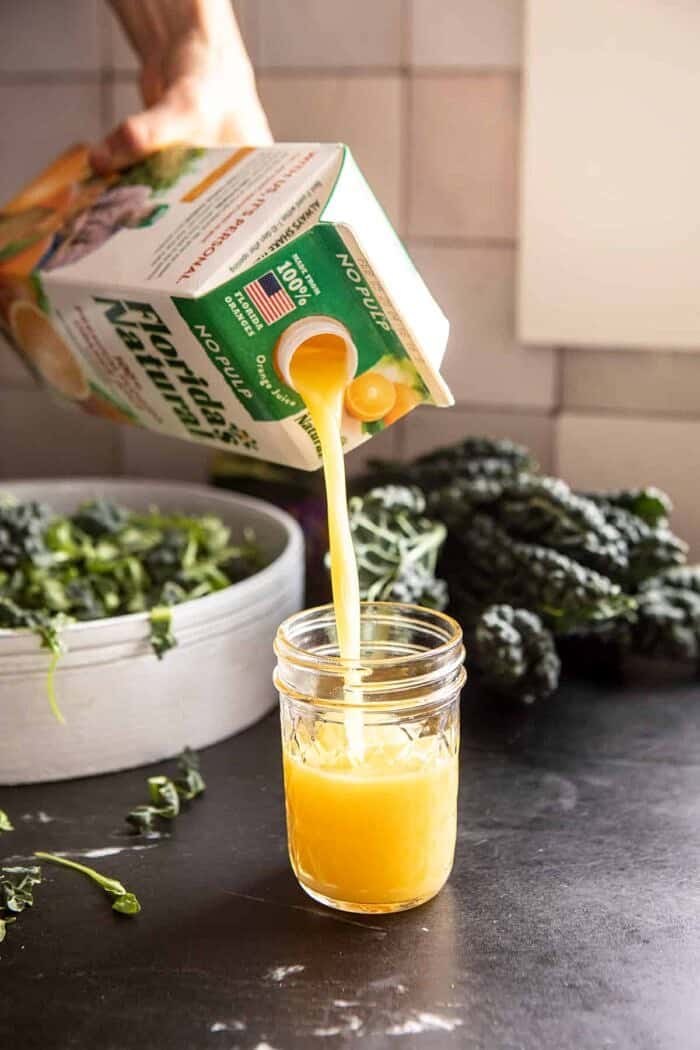 action shot of pouring orange juice 