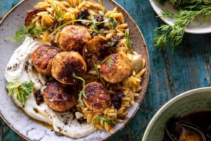 horizontal photo of One Skillet Greek Meatballs and Lemon Butter Orzo