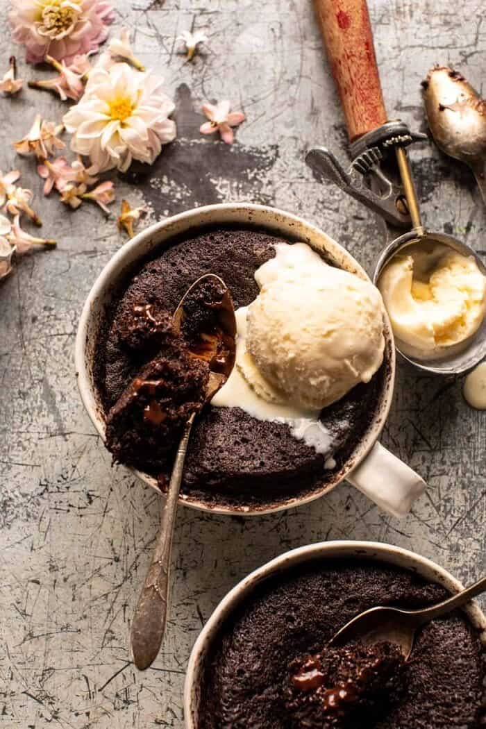 overhead photo of 5 Minute Molten Chocolate Mug Cake with ice cream on top 