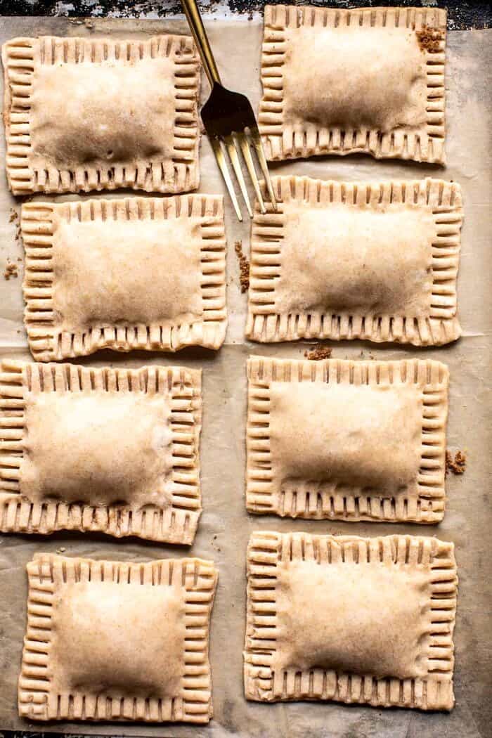 overhead prep photo of Homemade Frosted Brown Sugar Cinnamon Pop Tarts on baking sheet before baking 