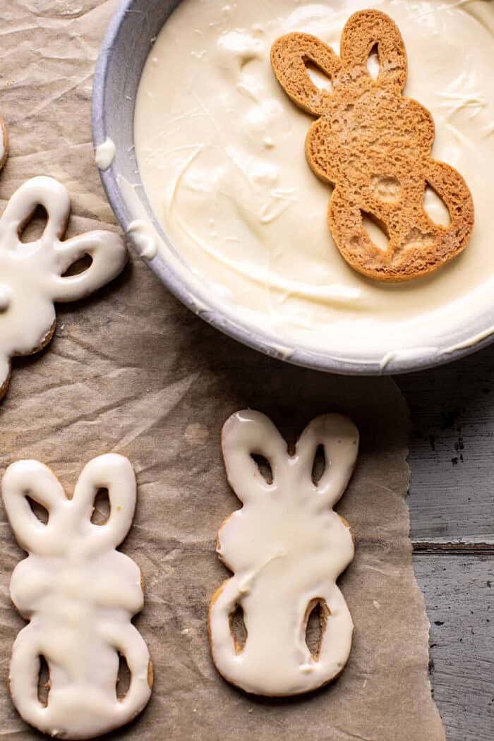 prep photo of dipping Peanut Butter Bunny Cookies in white chocolate