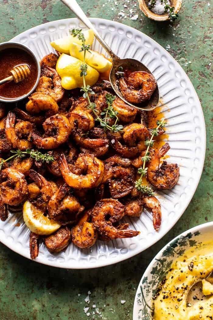 overhead photo of 15 Minute Cajun Hot Honey Butter Shrimp on serving plate with spoon