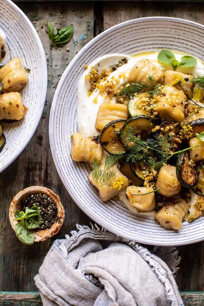 overhead close up photo of Cauliflower Gnocchi with Crispy Zucchini and Whipped Goat Cheese | halfbakedharvest.com