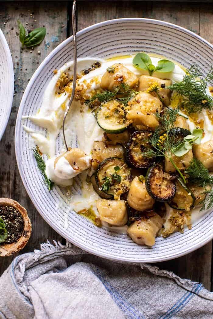 photo of Cauliflower Gnocchi with Crispy Zucchini and Whipped Goat Cheese with fork in bowl 