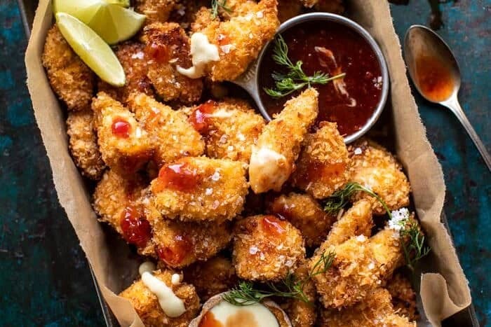 overhead horizontal photo of Coconut Popcorn Chicken with Sweet Thai Chili Lime Sauce