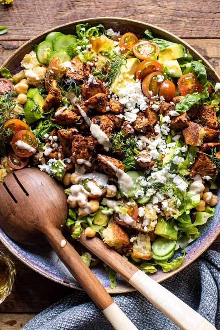 overhead close up photo of Greek Chicken Chopped Salad with Lemon Tahini Vinaigrette