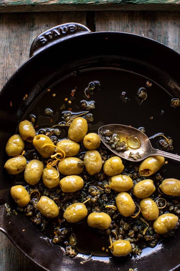 overhead photo of olives in skillet 