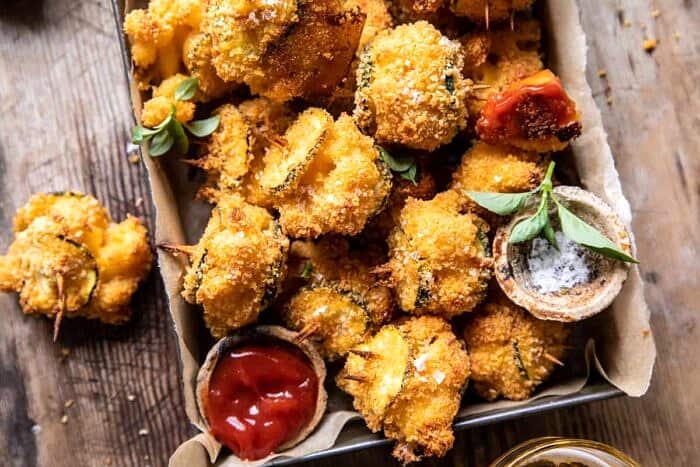 overhead horizontal photo of Mac and Cheese Stuffed Oven Fried Zucchini Bites in serving basket