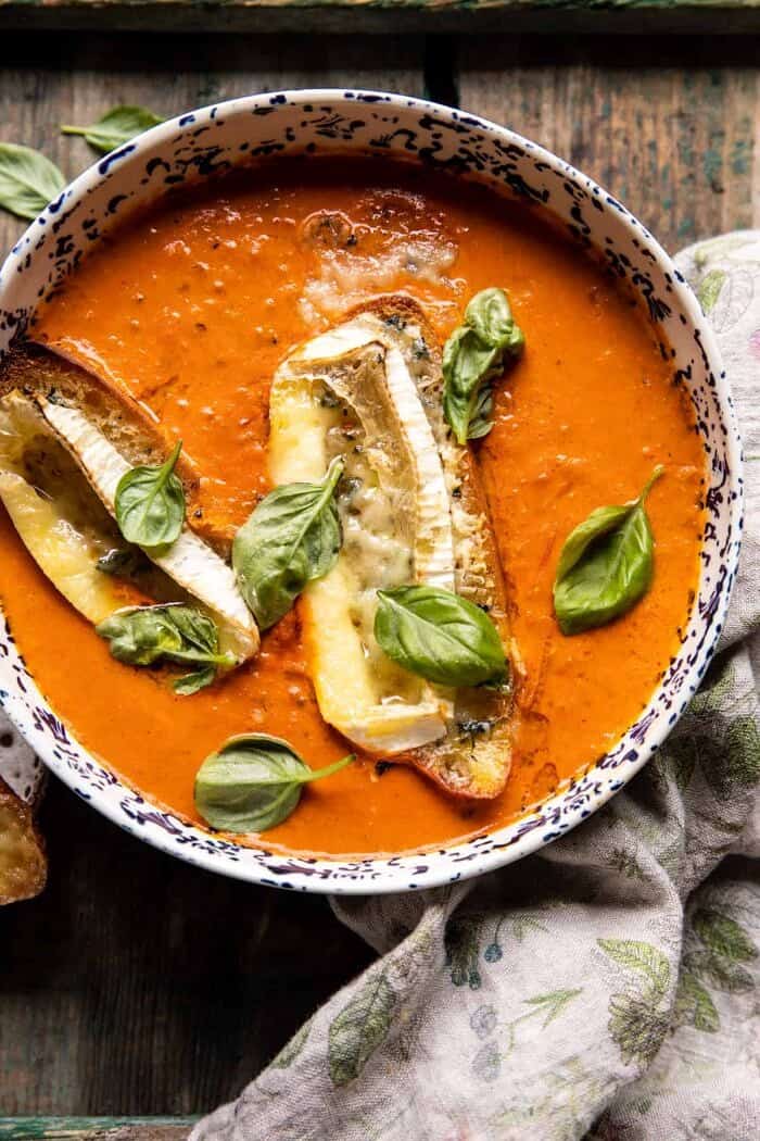 overhead close up photo of Easiest Herby Tomato Soup with Melted Brie Crostini