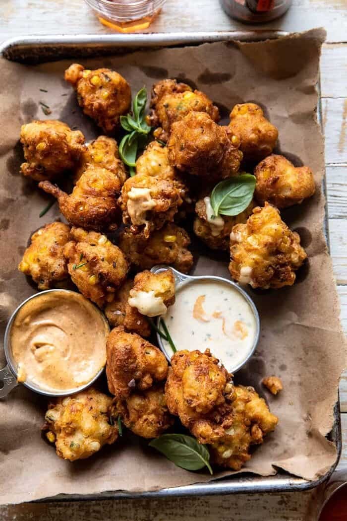 overhead close up photo of Jalapeño Cheddar Corn Fritters with Chipotle Aioli 