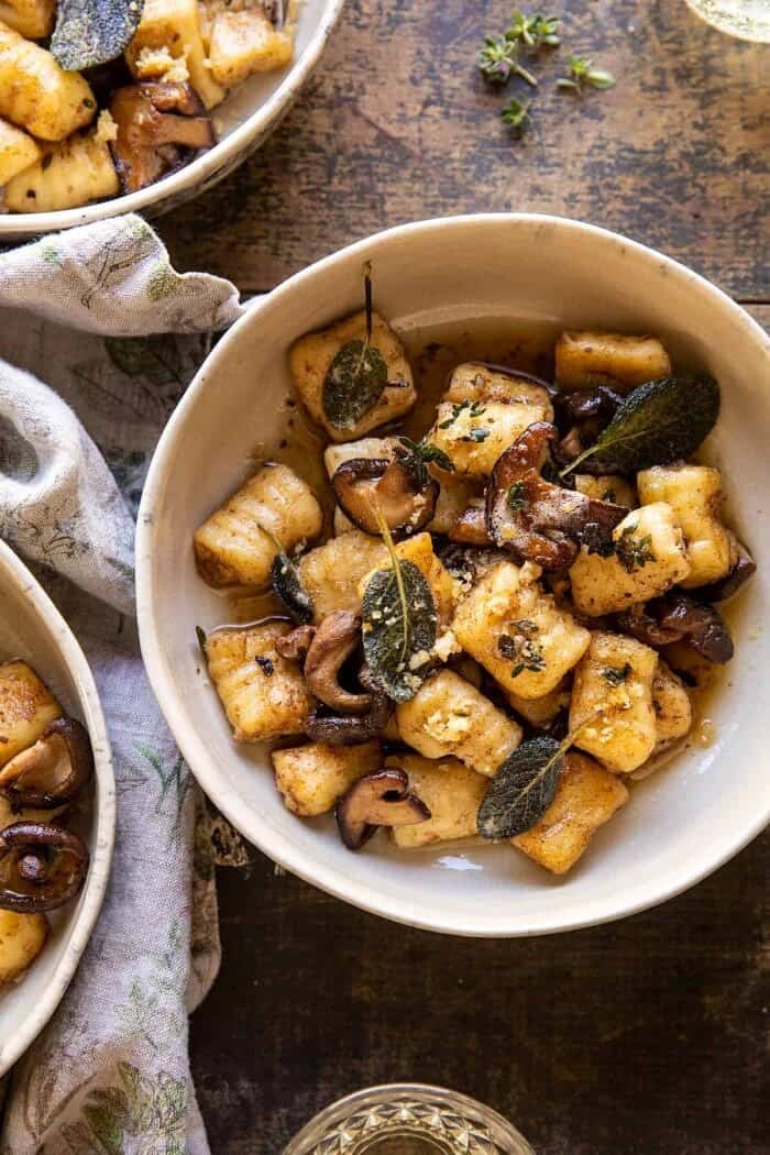 overhead close up photo of Ricotta Gnocchi with Herby Mushrooms and Sage Browned Butter