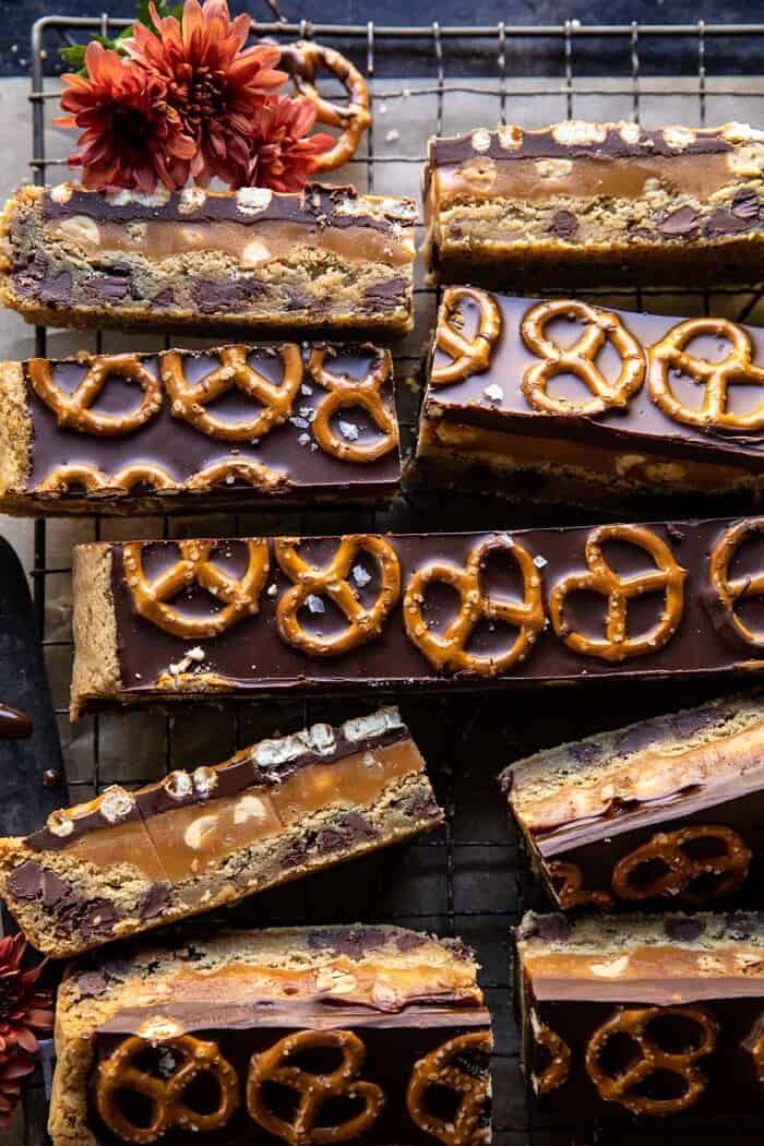 overhead close up photo of Salted Pretzel Chocolate Chip Cookie Snickers Bars 