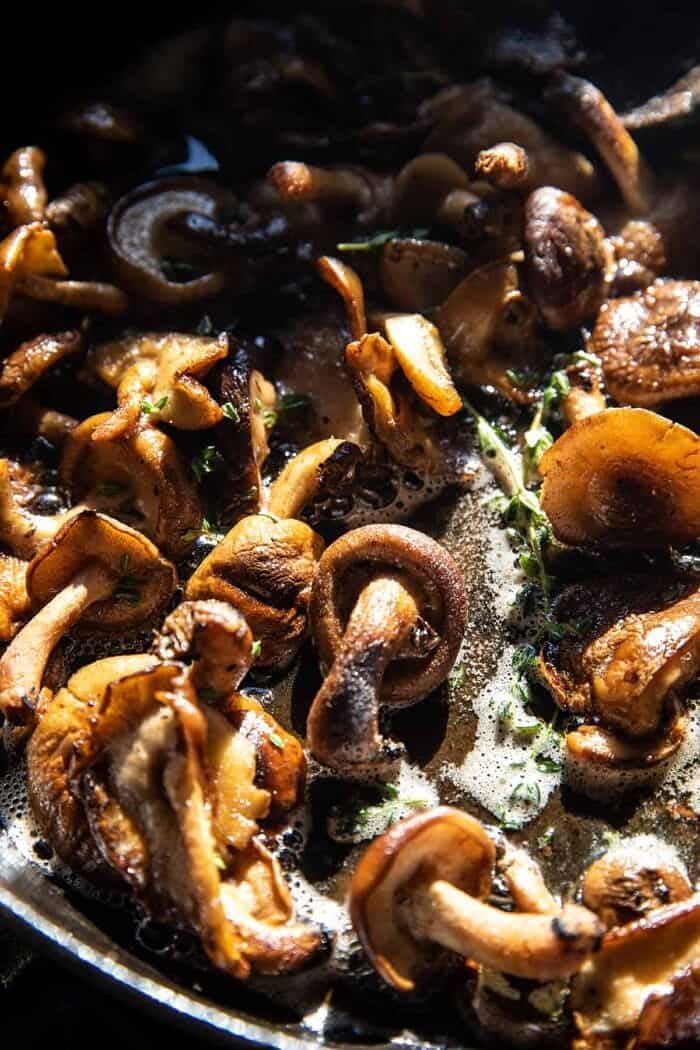 mushrooms cooking in skillet 