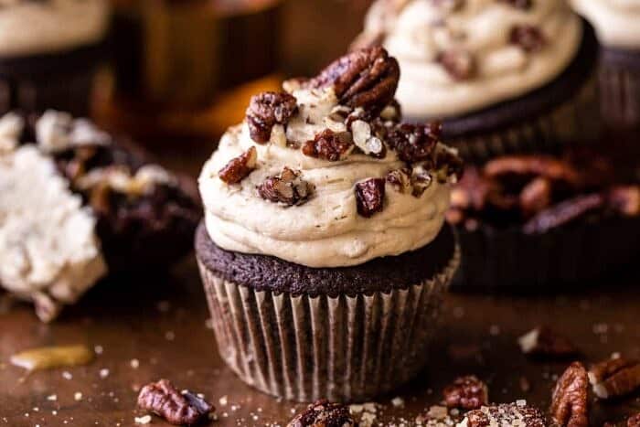 side angled photo of Chocolate Bourbon Pecan Pie Cupcakes with Butter Pecan Frosting