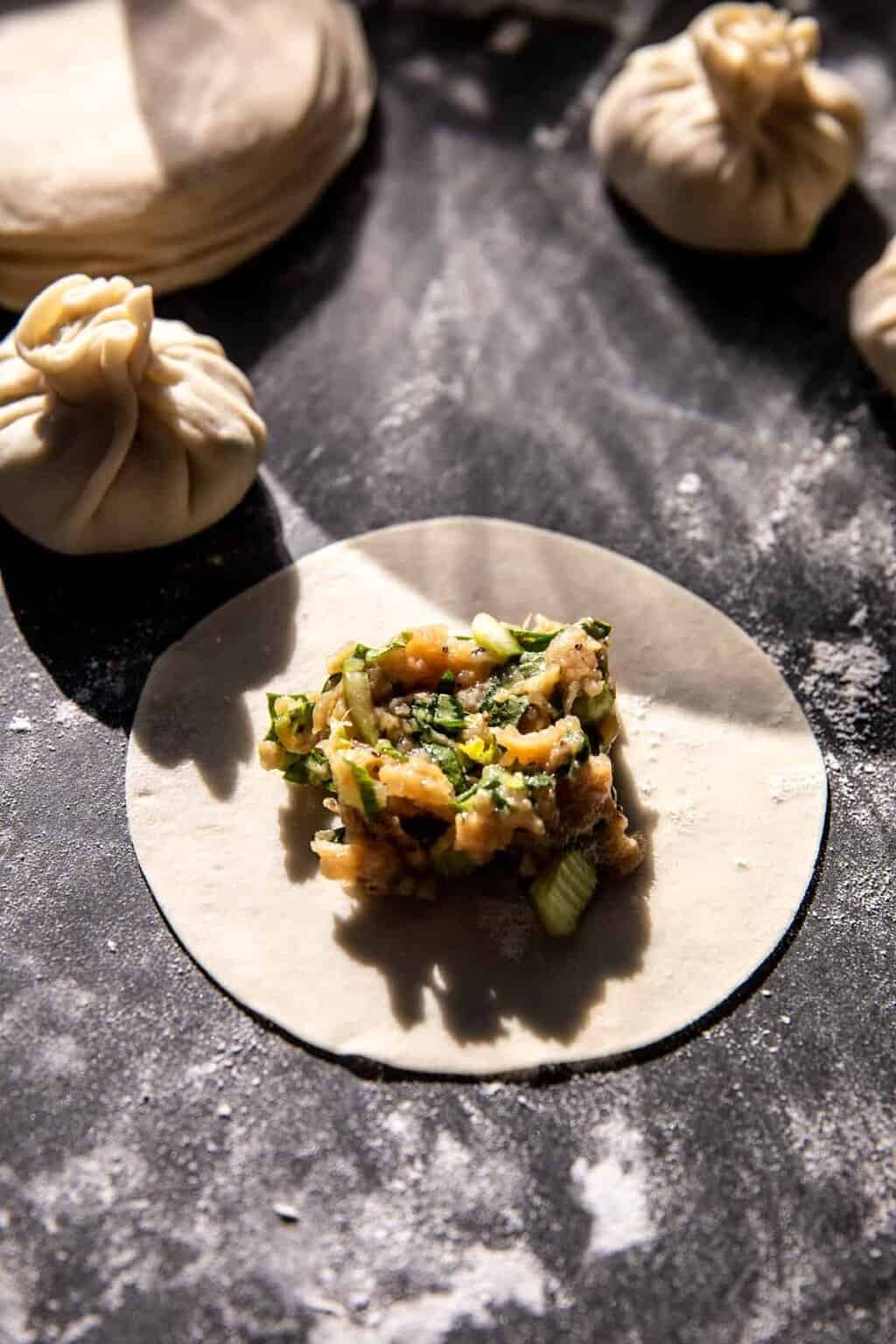 Sesame Chicken Dumplings in Spicy Broth with Garlic Crisps. Half