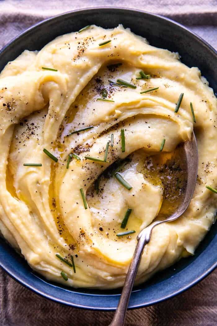 overhead close up photo of Slow Cooker Cheesy Garlic Herb Mashed Potatoes