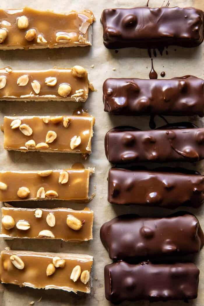 prep photo of Easy Homemade Vegan Snickers being dipped in chocolate