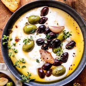 Honey Whipped Feta with Garlic Herb Roasted Olives | halfbakedharvest.com