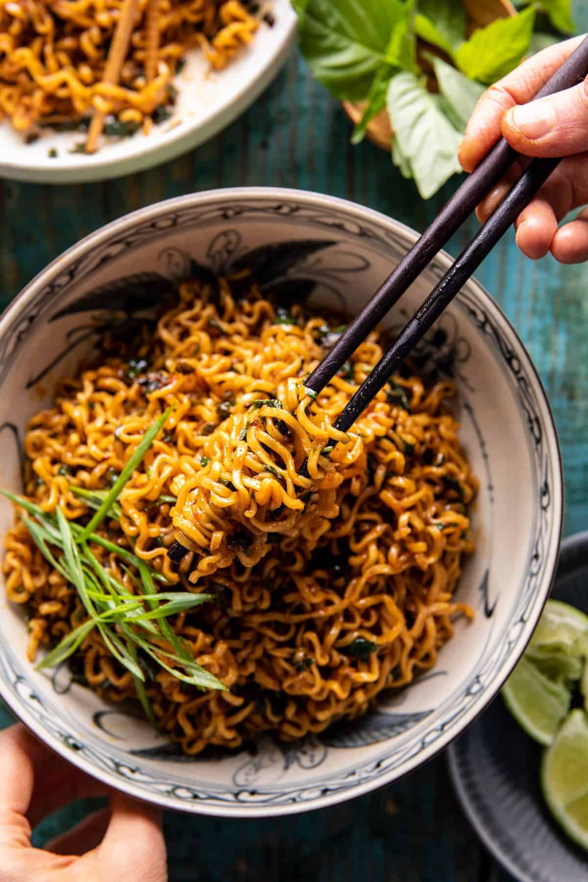 overhead photo of noodles in a bowl with chopsticks