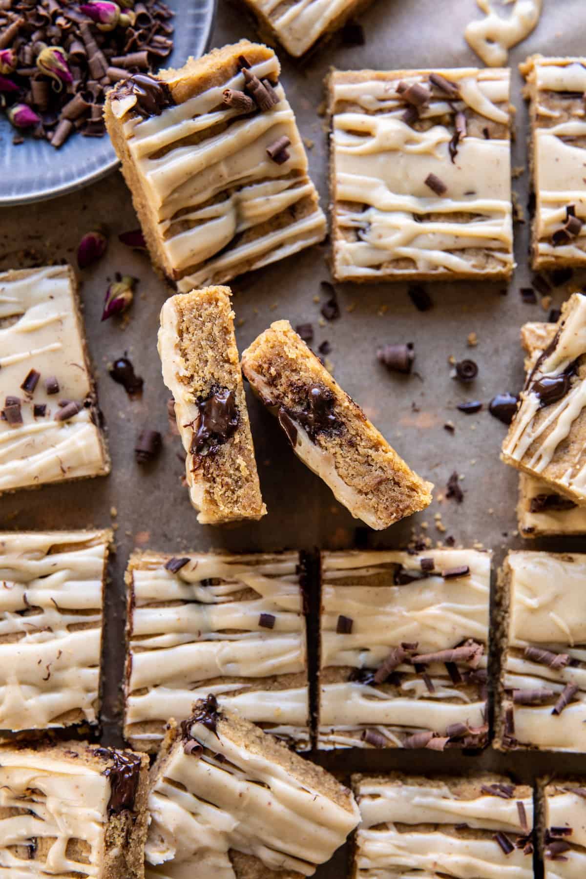 Brown Butter Glazed Peanut Butter Blondies with chocolate show and chocolate curls 