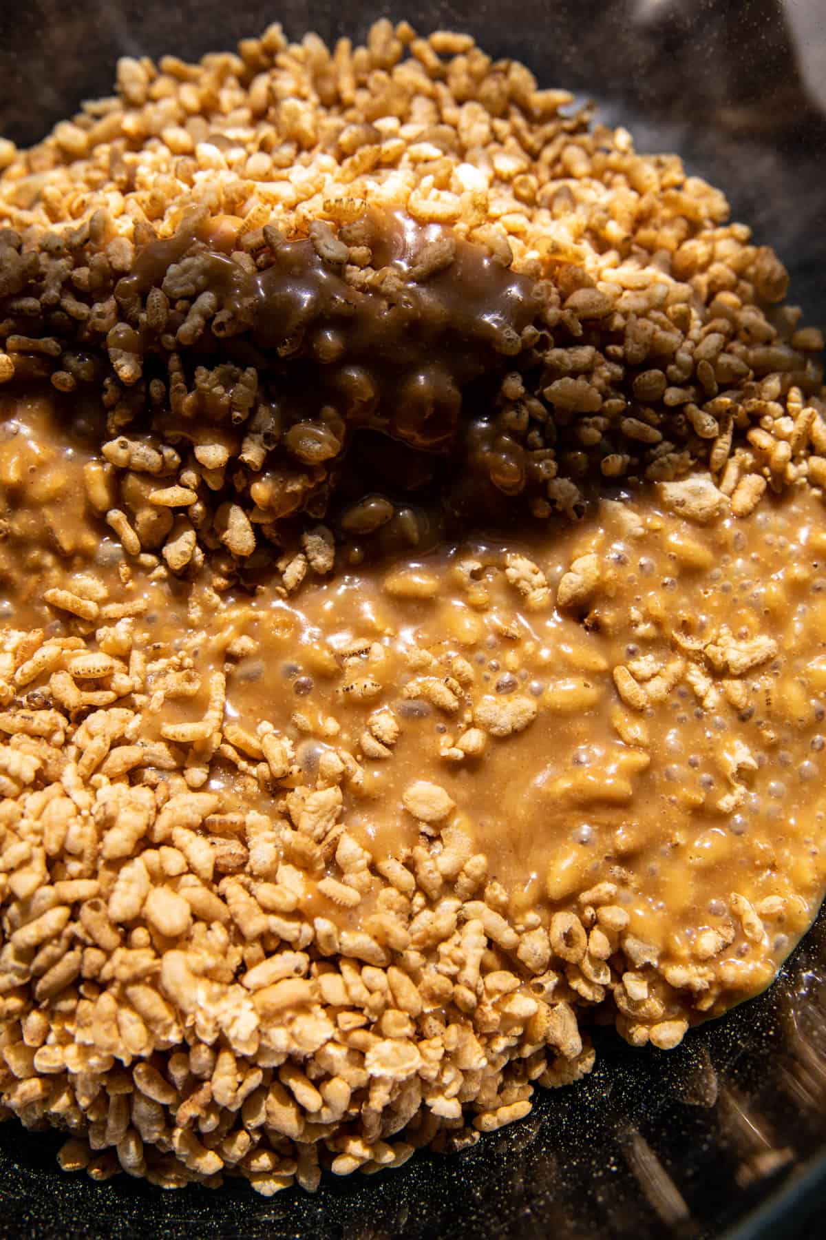 brown rice krispies and peanut butter in mixing bowl 