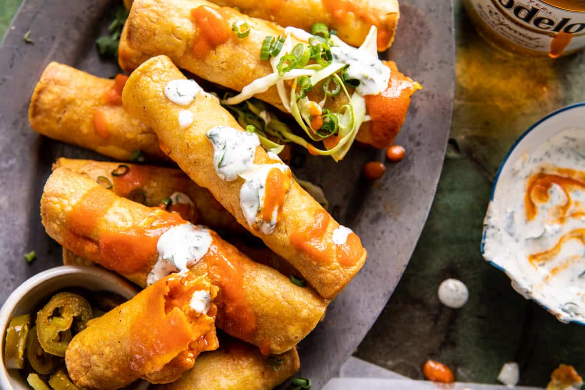 Taquitos on serving plate with ranch