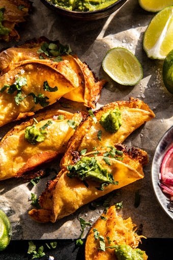 Crockpot Crispy Chicken Tinga Tacos with Avocado Jalapeño Crema | halfbakedharvest.com