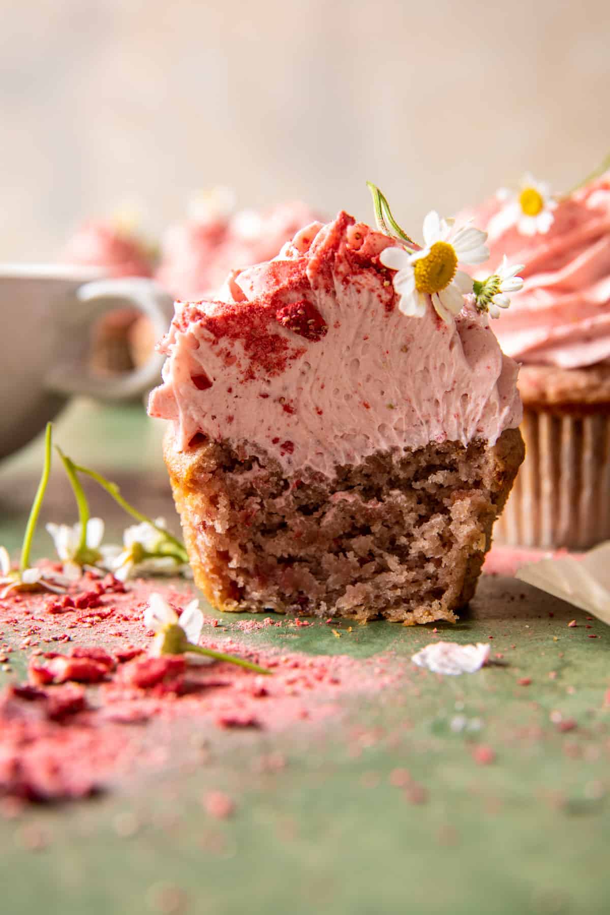 strawberry cupcake with bite taken out 