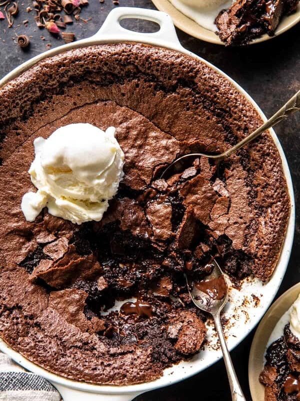 photo of pudding with ice cream on top and spoons in pudding