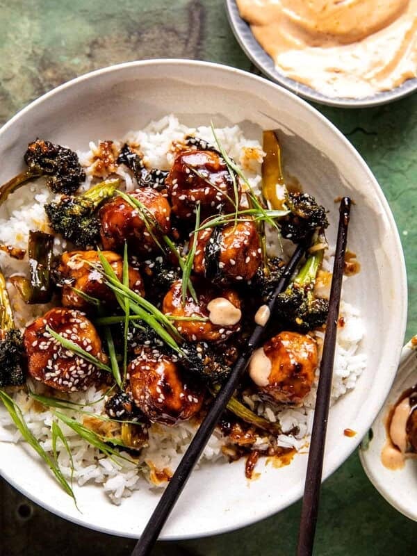 overhead photo of meatballs in bowl with rice and chopsticks