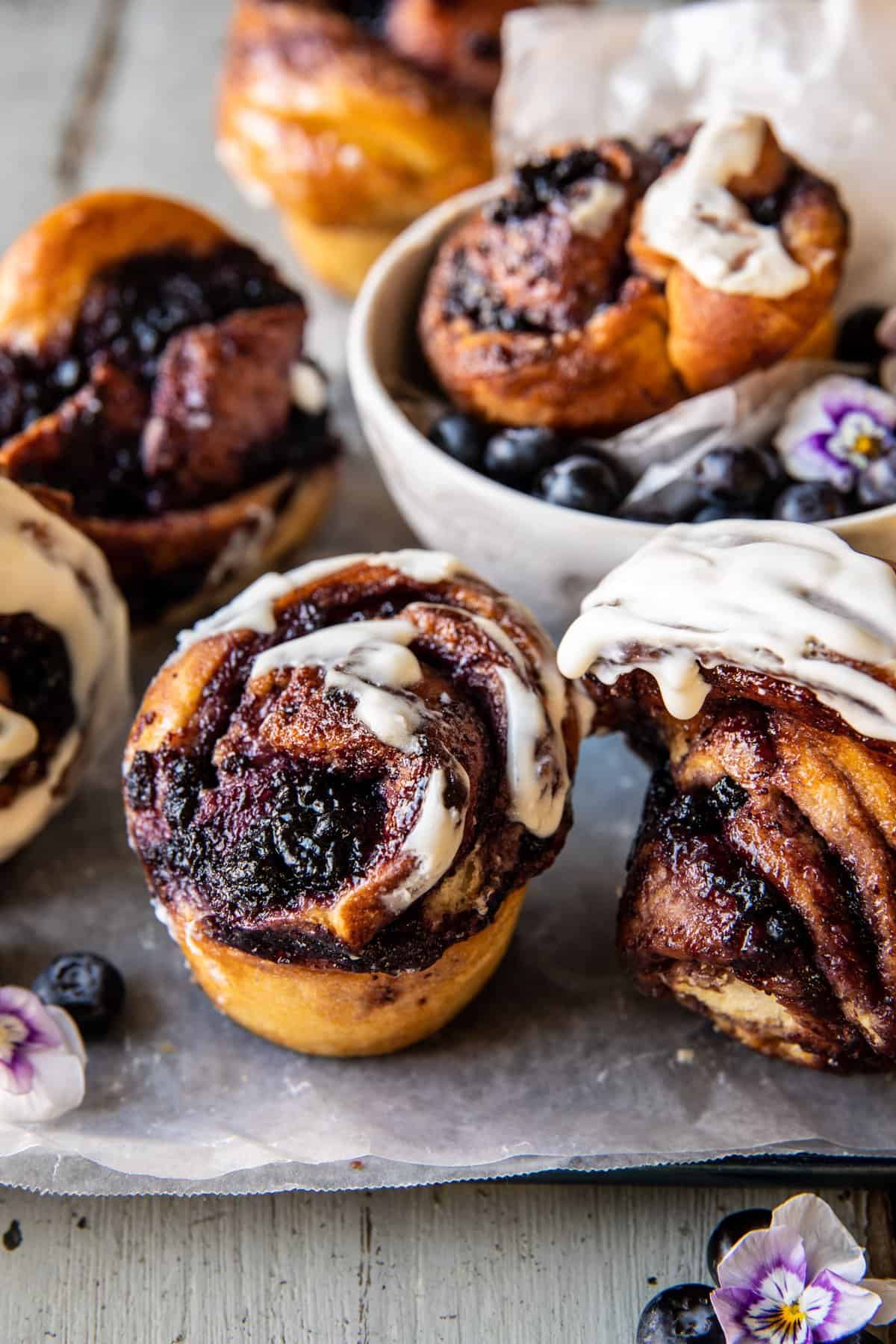 forward facing photo of blueberry rolls with multiple rolls in photo 