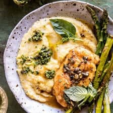 chicken on aplate with polenta and asparagus