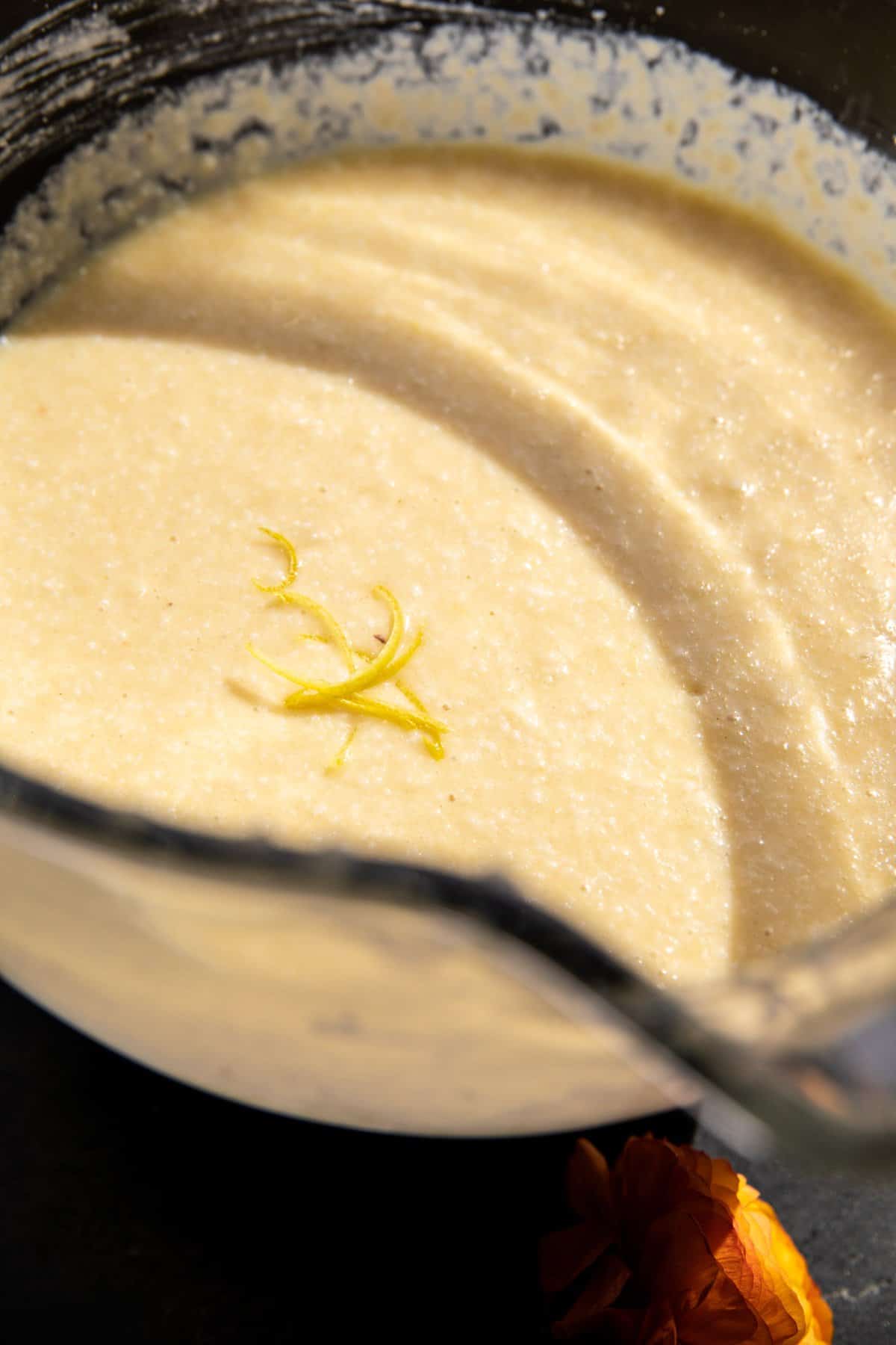 process photo of lemon cake batter in mixing bowl 