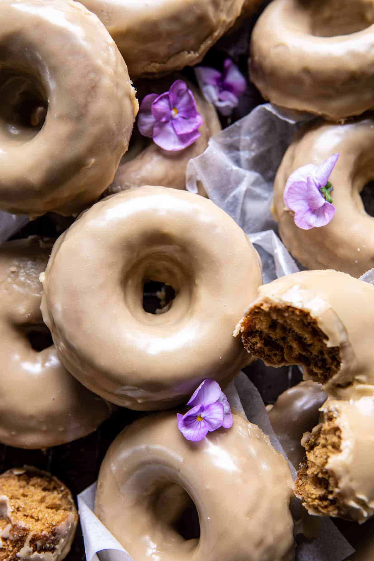 overhead close up photo of doughnuts with flowers