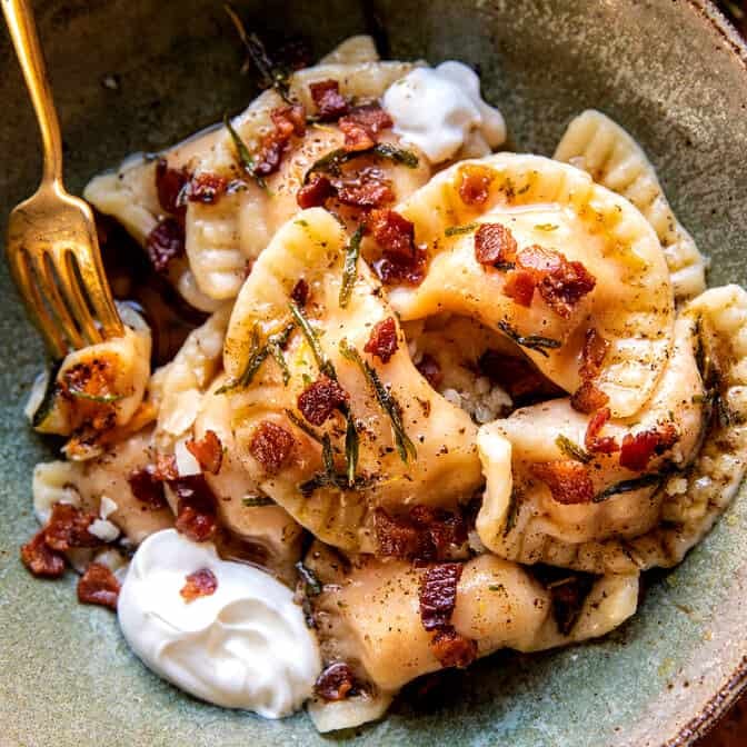 Sweet Potato Cheddar Pierogi with Bacon Bits | halfbakedharvest.com